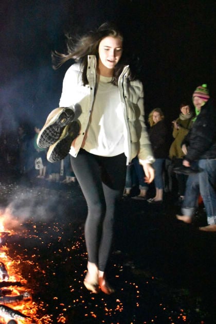 Supporter of Yorkshire Cat Rescue walking across hot coals at their Firewalk